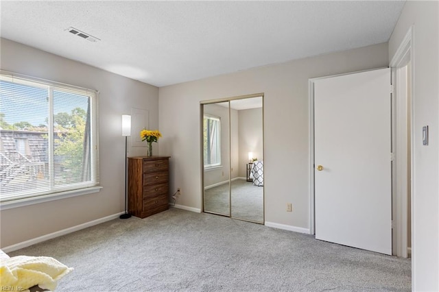 1107 Ocean Pebbles Way, Virginia Beach, VA 23451 - bedroom with carpet floors, a closet, baseboards, and a textured ceiling