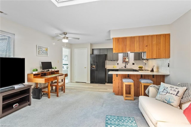 1107 Ocean Pebbles Way, Virginia Beach, VA 23451 - living area featuring a desk, light colored carpet, and a ceiling fan