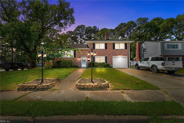 119 Waltham St, Hampton, VA 23666 - view of front of home featuring a garage, driveway, a chimney, brick siding, and a yard