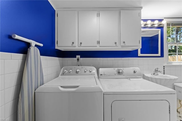 119 Waltham St, Hampton, VA 23666 - laundry room featuring tile walls, washer and dryer, and wainscoting