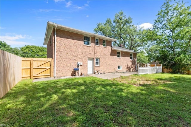 119 Waltham St, Hampton, VA 23666 - rear view of property with a patio area, a gate, and brick siding