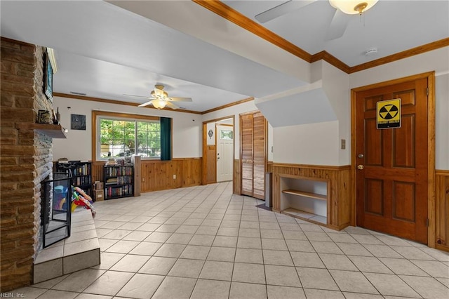 119 Waltham St, Hampton, VA 23666 - entryway with a ceiling fan, a wainscoted wall, a large fireplace, wood walls, and ornamental molding