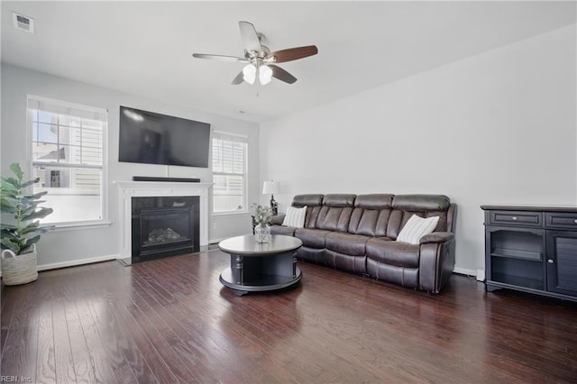2209 Beeblossom Ln, Chesapeake, VA 23323 - living room with ceiling fan, a glass covered fireplace, wood finished floors, and baseboards