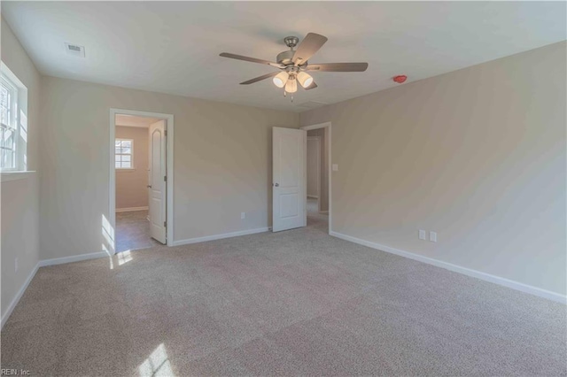 2807 Eustis Ave, Chesapeake, VA 23325 - unfurnished bedroom featuring baseboards, light carpet, ceiling fan, and ensuite bathroom