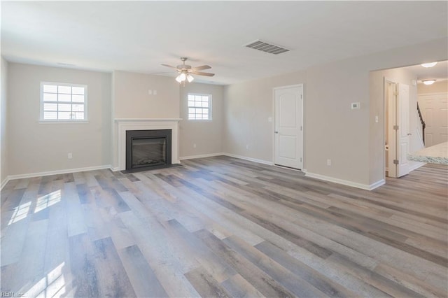 2807 Eustis Ave, Chesapeake, VA 23325 - unfurnished living room with ceiling fan, wood finished floors, baseboards, and a fireplace with flush hearth