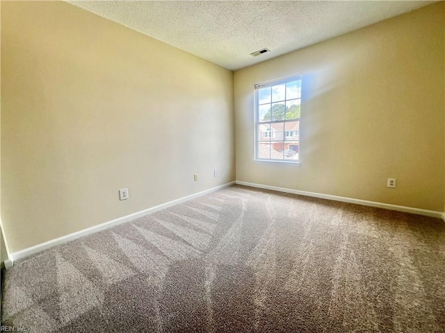 2511 Hartley St, Virginia Beach, VA 23456 - carpeted spare room featuring a textured ceiling and baseboards