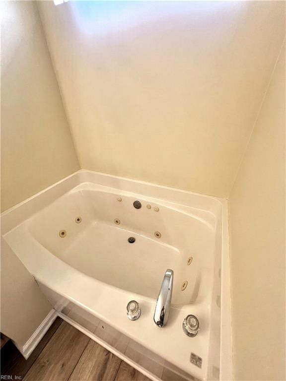 2511 Hartley St, Virginia Beach, VA 23456 - bathroom with a whirlpool tub and wood finished floors