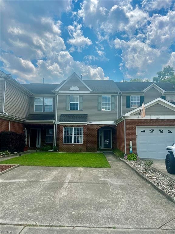 2511 Hartley St, Virginia Beach, VA 23456 - multi unit property featuring brick siding, a garage, and a front lawn