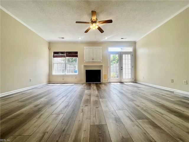 2511 Hartley St, Virginia Beach, VA 23456 - unfurnished living room featuring ornamental molding, hardwood / wood-style floors, healthy amount of natural light, a ceiling fan, and a textured ceiling