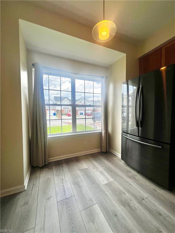 2511 Hartley St, Virginia Beach, VA 23456 - kitchen featuring freestanding refrigerator, light wood-type flooring, baseboards, and decorative light fixtures