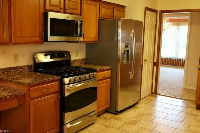1314 Hunningdon Woods Blvd, Chesapeake, VA 23320 - kitchen featuring stainless steel appliances, brown cabinets, and dark stone countertops
