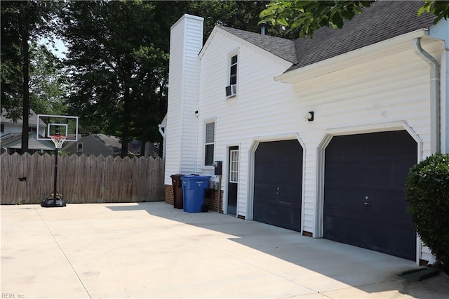 1314 Hunningdon Woods Blvd, Chesapeake, VA 23320 - view of home's exterior with roof with shingles, a chimney, driveway, and an attached garage