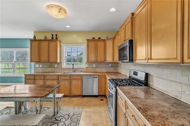 1701 Sanderson Rd, Chesapeake, VA 23322 - kitchen with stainless steel appliances, a sink, backsplash, recessed lighting, and light countertops