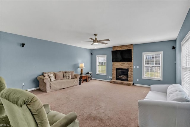 1701 Sanderson Rd, Chesapeake, VA 23322 - carpeted living room with baseboards, ceiling fan, healthy amount of natural light, and a stone fireplace