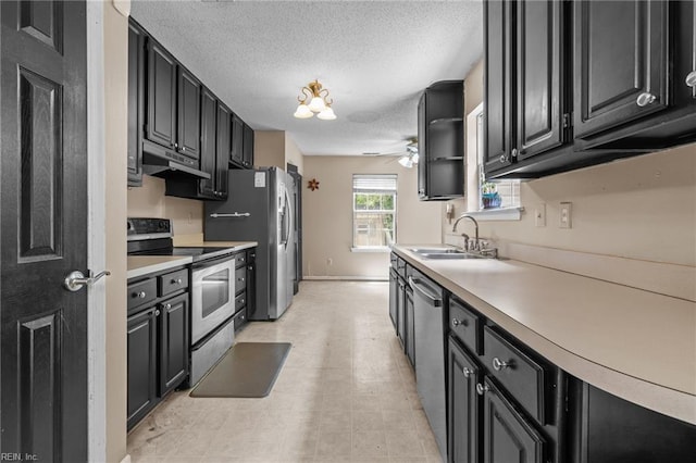 520 Kemp Lndg, Suffolk, VA 23434 - kitchen with stainless steel appliances, ceiling fan, under cabinet range hood, a textured ceiling, and dark cabinetry