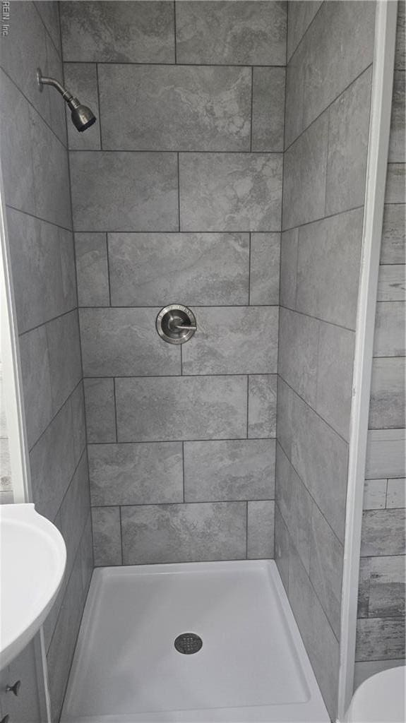 5604 Pontiac Rd, Virginia Beach, VA 23462 - bathroom with a stall shower, toilet, and a sink