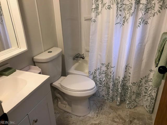 9917 Friendship Rd, North, VA 23128 - bathroom featuring vanity, toilet, and shower / bath combo with shower curtain