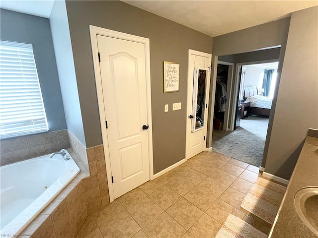 131 Hawks Nest Ln, Suffolk, VA 23435 - full bath featuring a garden tub, tile patterned flooring, vanity, a closet, and connected bathroom