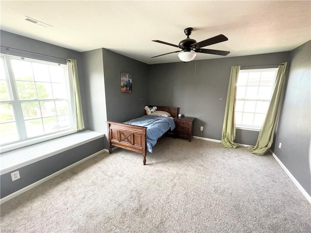 131 Hawks Nest Ln, Suffolk, VA 23435 - carpeted bedroom with baseboards, a ceiling fan, and a textured ceiling
