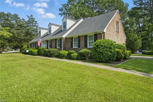 2820 Meadowgreen Ct, Chesapeake, VA 23321 - view of home's exterior with brick siding, a shingled roof, and a yard