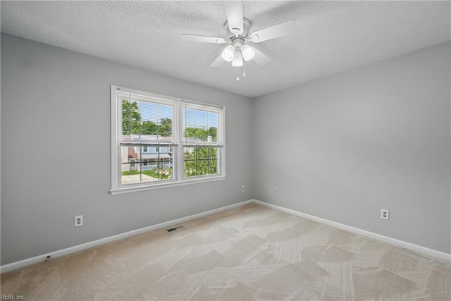 1803 Carrollwood Cmn, Chesapeake, VA 23320 - unfurnished room with baseboards, light colored carpet, a ceiling fan, and a textured ceiling
