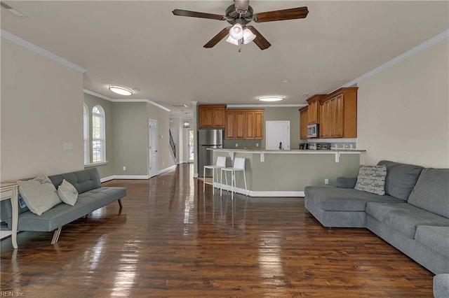 7556 Villa Ct, Gloucester, VA 23061 - living room with ornamental molding, a ceiling fan, dark wood-style flooring, and baseboards
