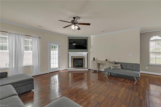 7556 Villa Ct, Gloucester, VA 23061 - living area with ceiling fan, wood finished floors, a glass covered fireplace, plenty of natural light, and ornamental molding