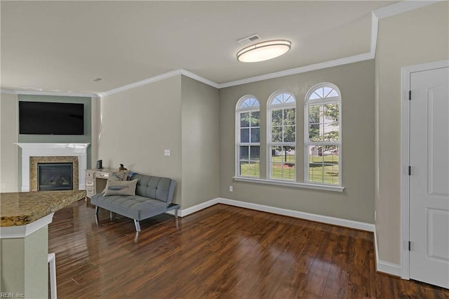 7556 Villa Ct, Gloucester, VA 23061 - sitting room with ornamental molding, wood finished floors, a glass covered fireplace, and baseboards