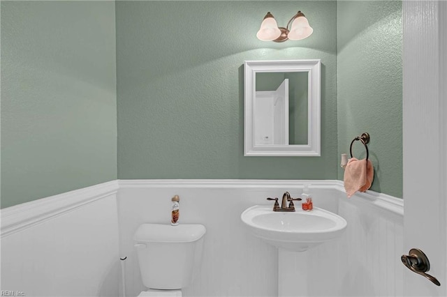 7556 Villa Ct, Gloucester, VA 23061 - half bath featuring toilet and a wainscoted wall