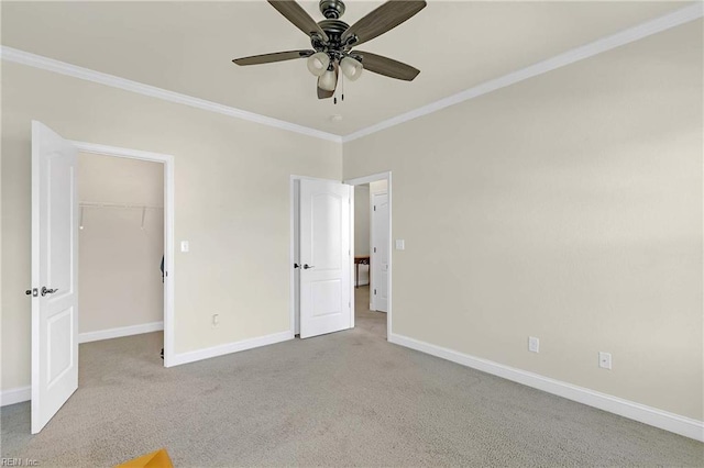7556 Villa Ct, Gloucester, VA 23061 - unfurnished bedroom featuring ornamental molding, baseboards, a walk in closet, and carpet