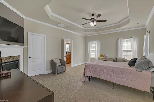 7556 Villa Ct, Gloucester, VA 23061 - bedroom with a raised ceiling, carpet, crown molding, a glass covered fireplace, and a ceiling fan