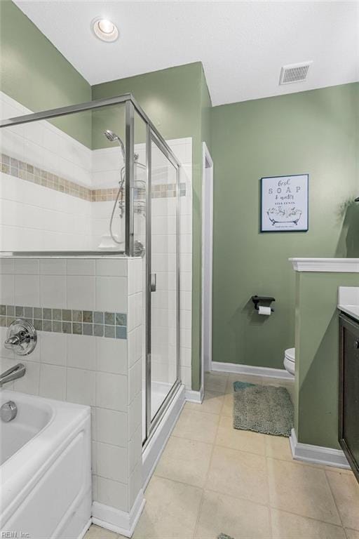 3101 Bridgewater Dr, Carrollton, VA 23314 - full bathroom with a shower stall, a bath, vanity, toilet, and tile patterned floors