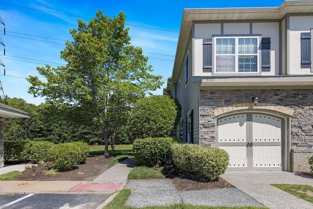 3101 Bridgewater Dr, Carrollton, VA 23314 - view of home's exterior with stone siding and a garage