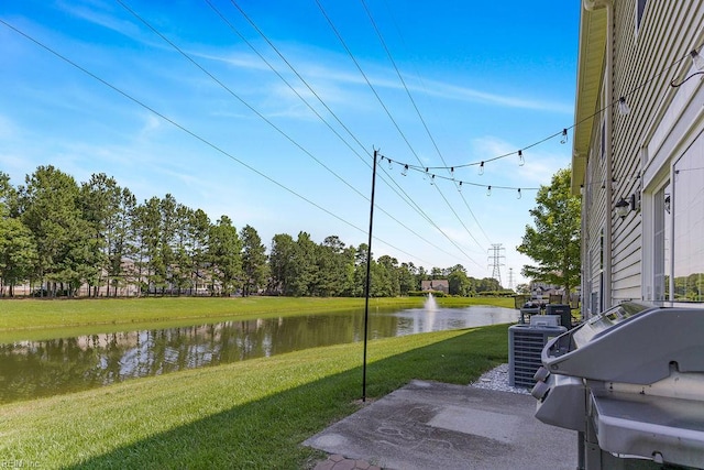 3101 Bridgewater Dr, Carrollton, VA 23314 - view of green lawn with central AC and a water view