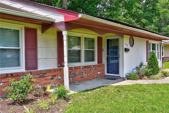 409 Barcelona Ln, Virginia Beach, VA 23452 - property entrance featuring brick siding and a lawn