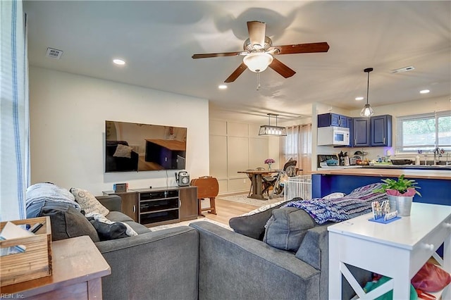 409 Barcelona Ln, Virginia Beach, VA 23452 - living area featuring a ceiling fan, wood finished floors, and recessed lighting