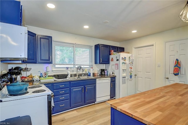 409 Barcelona Ln, Virginia Beach, VA 23452 - kitchen with white appliances, blue cabinetry, wood counters, a sink, and recessed lighting