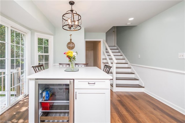 613 S Claypool Ct, Virginia Beach, VA 23464 - dining area with beverage cooler, stairway, healthy amount of natural light, a chandelier, and recessed lighting