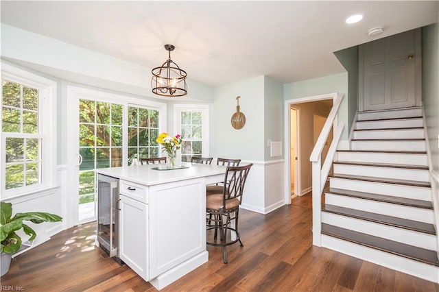 613 S Claypool Ct, Virginia Beach, VA 23464 - dining area with a chandelier, stairs, beverage cooler, dark wood-type flooring, and recessed lighting