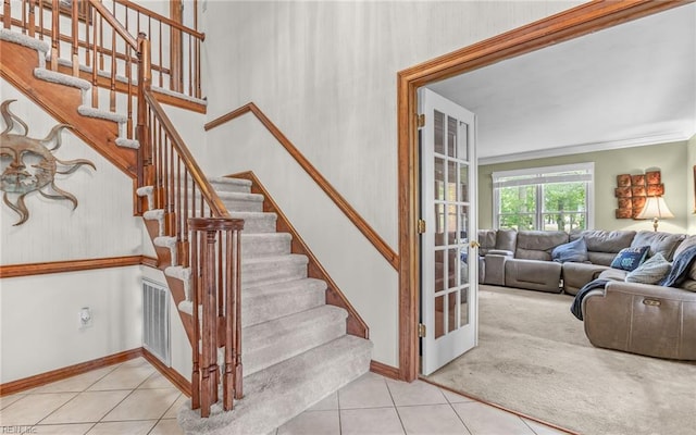 1001 Fairway Ct, Chesapeake, VA 23320 - staircase featuring tile patterned flooring, french doors, baseboards, and crown molding