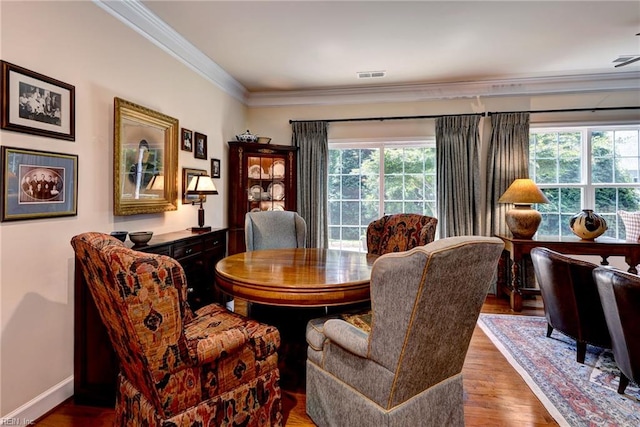 4108 Windmill Rd, Williamsburg, VA 23188 - dining area with crown molding, plenty of natural light, wood finished floors, and baseboards