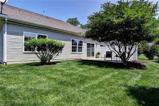 4108 Windmill Rd, Williamsburg, VA 23188 - rear view of house featuring a patio area, a lawn, and roof with shingles