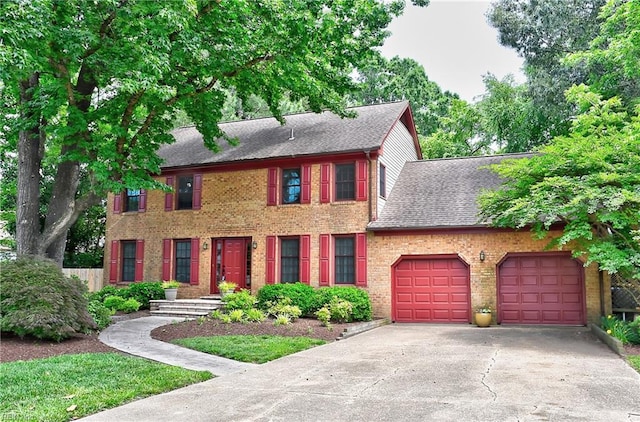 1204 Merrifield Lndg, Virginia Beach, VA 23464 - colonial house featuring driveway, an attached garage, brick siding, and roof with shingles