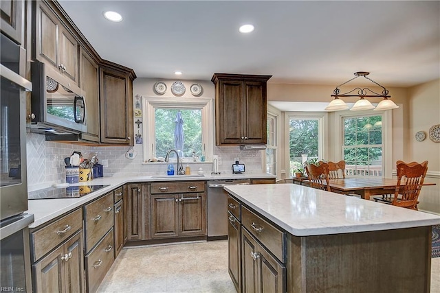 1204 Merrifield Lndg, Virginia Beach, VA 23464 - kitchen with appliances with stainless steel finishes, a sink, tasteful backsplash, a center island, and recessed lighting