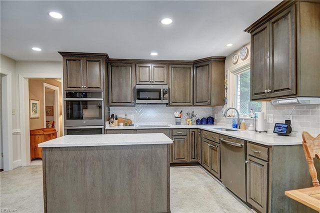 1204 Merrifield Lndg, Virginia Beach, VA 23464 - kitchen featuring a sink, stainless steel appliances, recessed lighting, light countertops, and backsplash