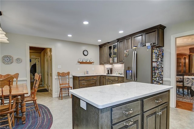 1204 Merrifield Lndg, Virginia Beach, VA 23464 - kitchen with stainless steel refrigerator with ice dispenser, recessed lighting, glass insert cabinets, open shelves, and dark brown cabinetry