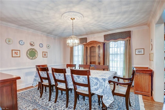 1204 Merrifield Lndg, Virginia Beach, VA 23464 - dining space featuring plenty of natural light, a chandelier, light wood-style flooring, and crown molding