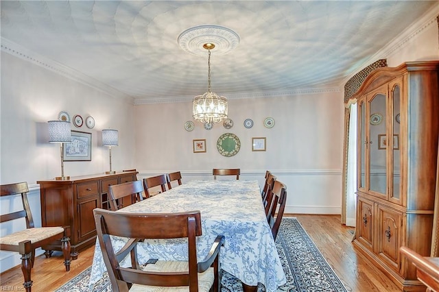 1204 Merrifield Lndg, Virginia Beach, VA 23464 - dining space featuring a chandelier, light wood-style floors, and ornamental molding