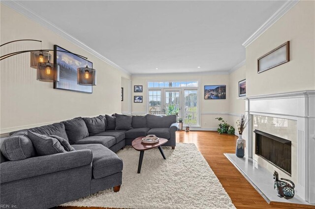 200 Congress Ave, Hampton, VA 23669 - living room featuring wood finished floors, ornamental molding, a high end fireplace, and recessed lighting