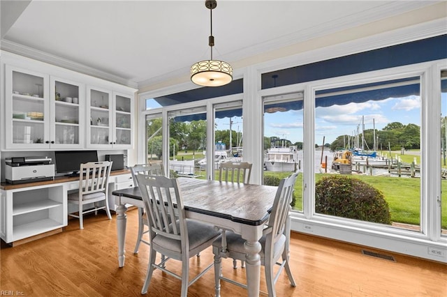 200 Congress Ave, Hampton, VA 23669 - dining area featuring crown molding and light wood-style floors